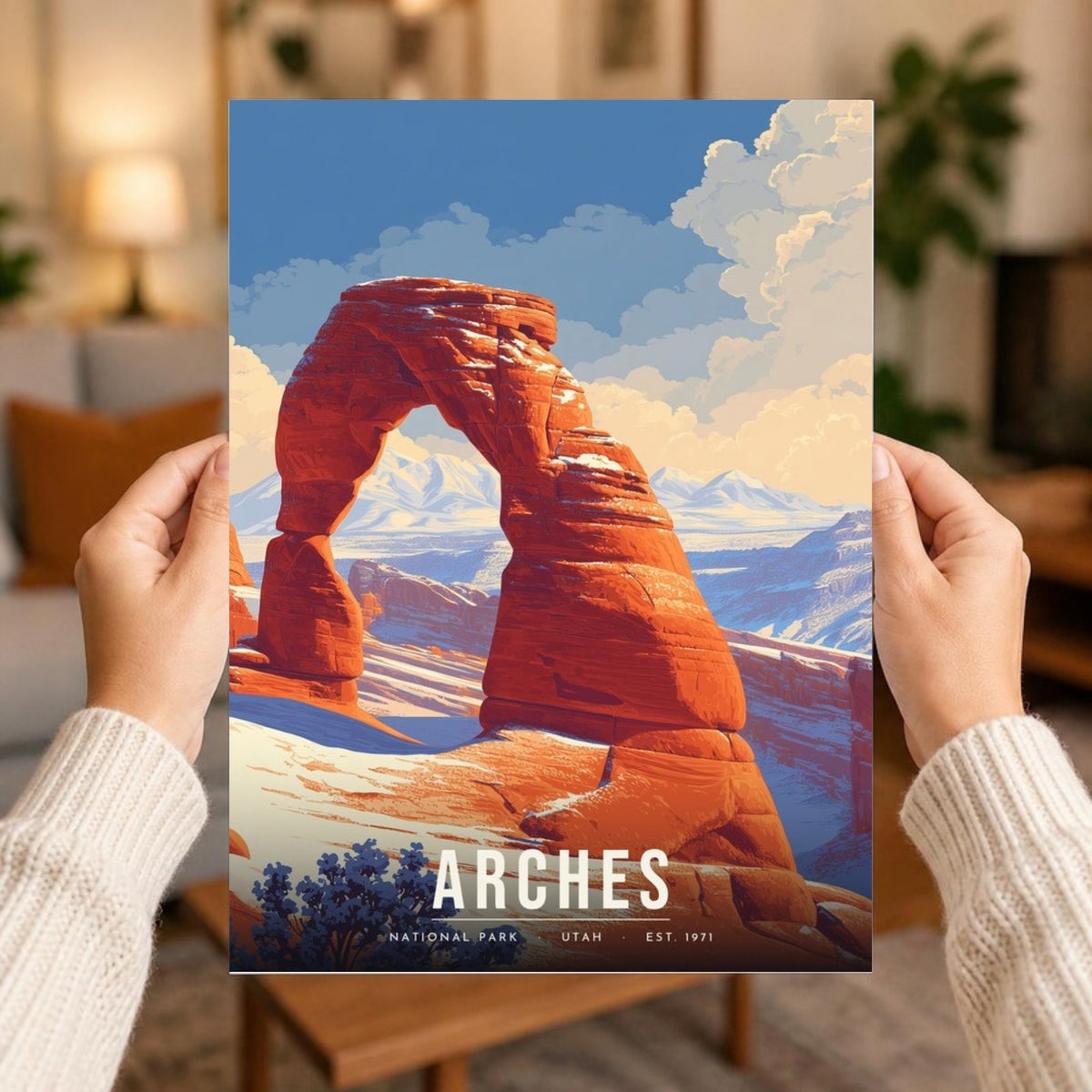 Arches in snow poster print held in two hands